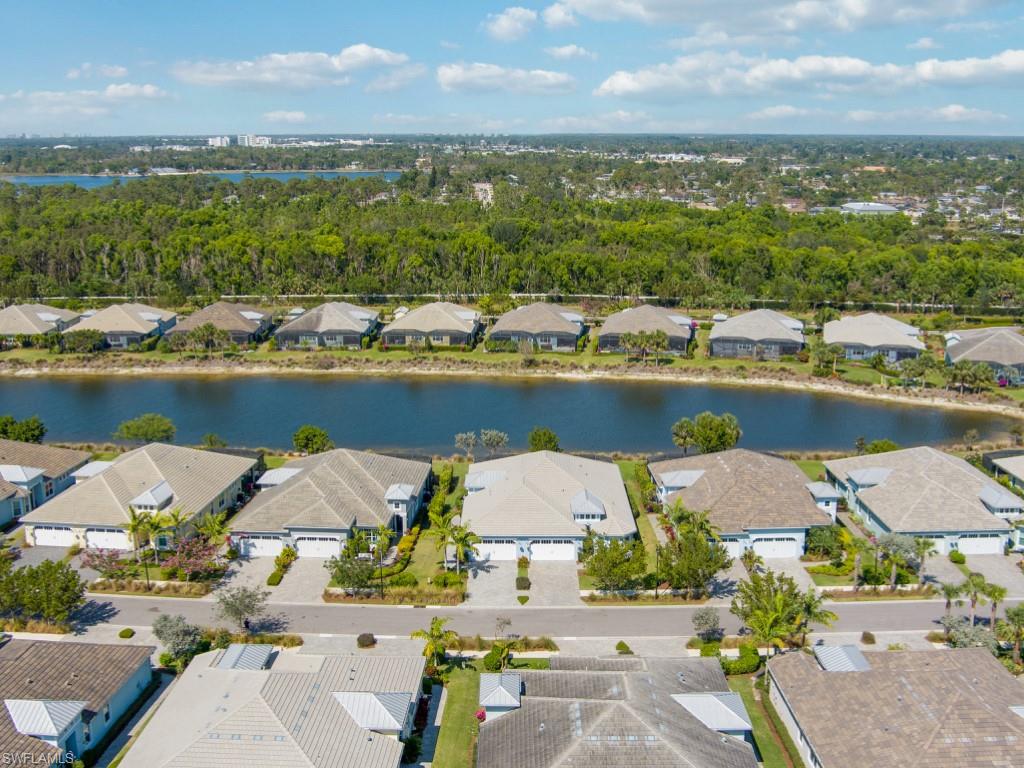 5697 Highbourne Drive Naples, FL 34113 - Photo 33 of 35 a view of a city with an ocean beach