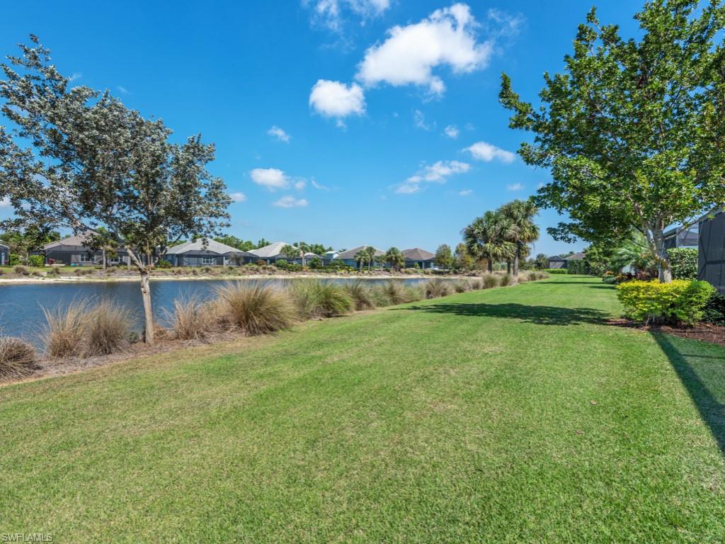5697 Highbourne Drive Naples, FL 34113 - Photo 35 of 35 a view of a lake with houses