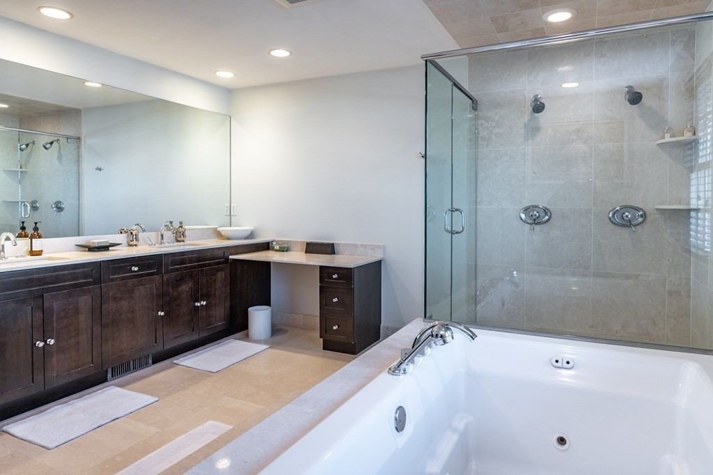 18 Fox Hill Road Newton, MA 02459 - Photo 17 of 37 a spacious bathroom with a tub sink shower and mirror