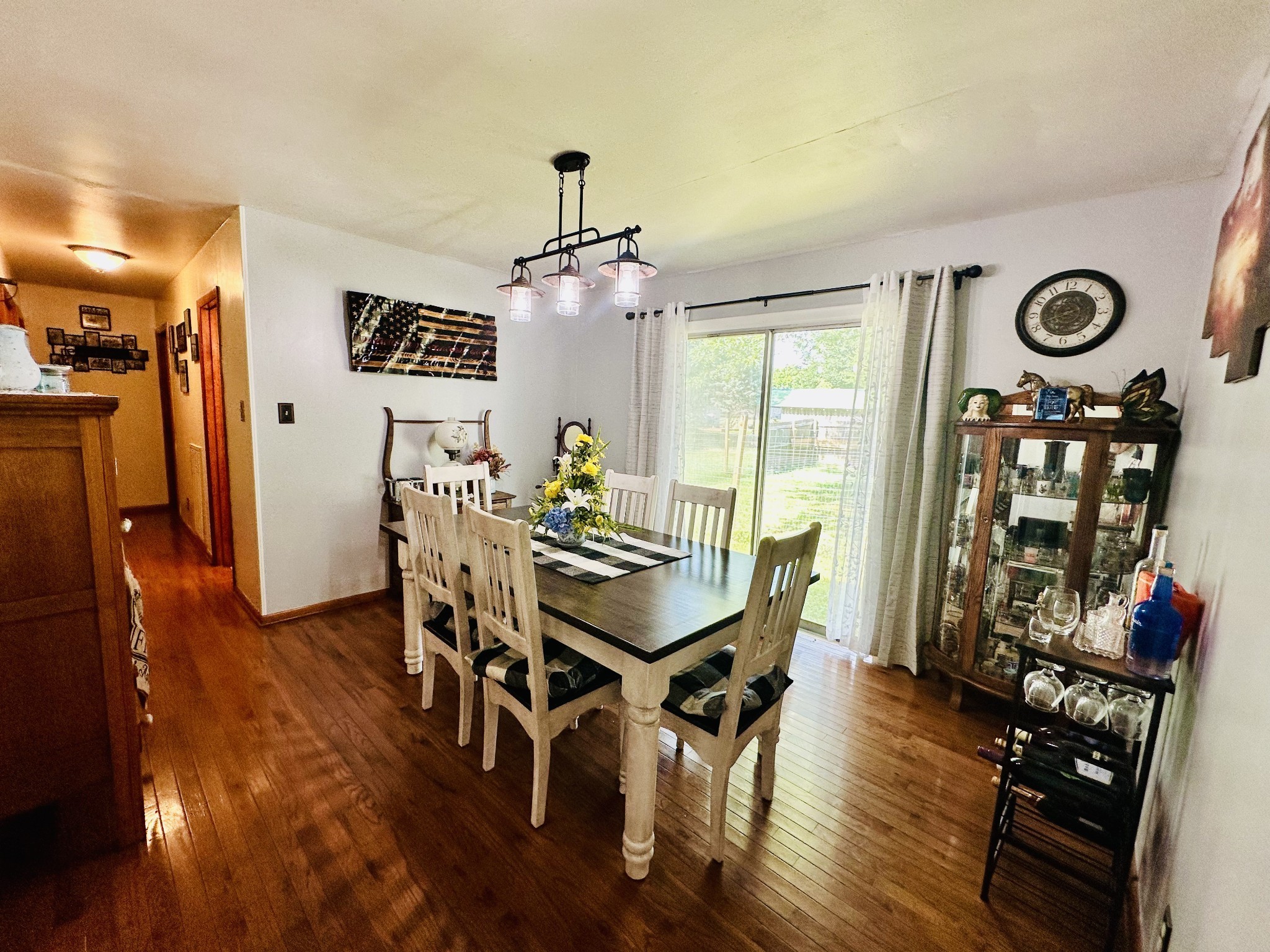 946 Monument Road Summertown, TN 38483 - Photo 11 of 23 a view of a dining room with furniture and wooden floor
