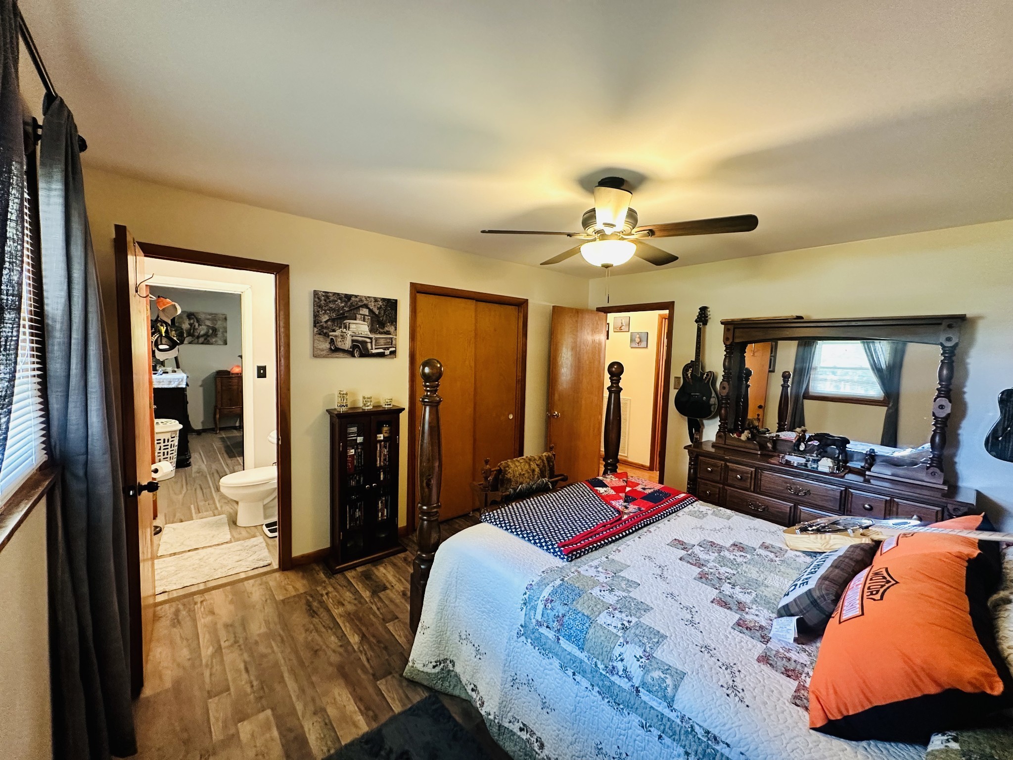 946 Monument Road Summertown, TN 38483 - Photo 13 of 23 a bedroom with a bed and a large mirror with furniture