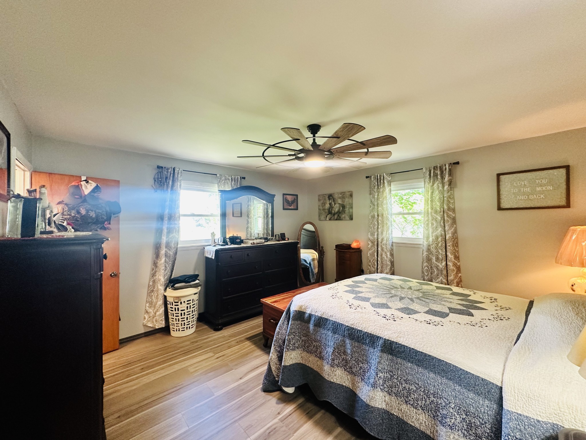 946 Monument Road Summertown, TN 38483 - Photo 16 of 23 a bedroom with a bed and wooden floor