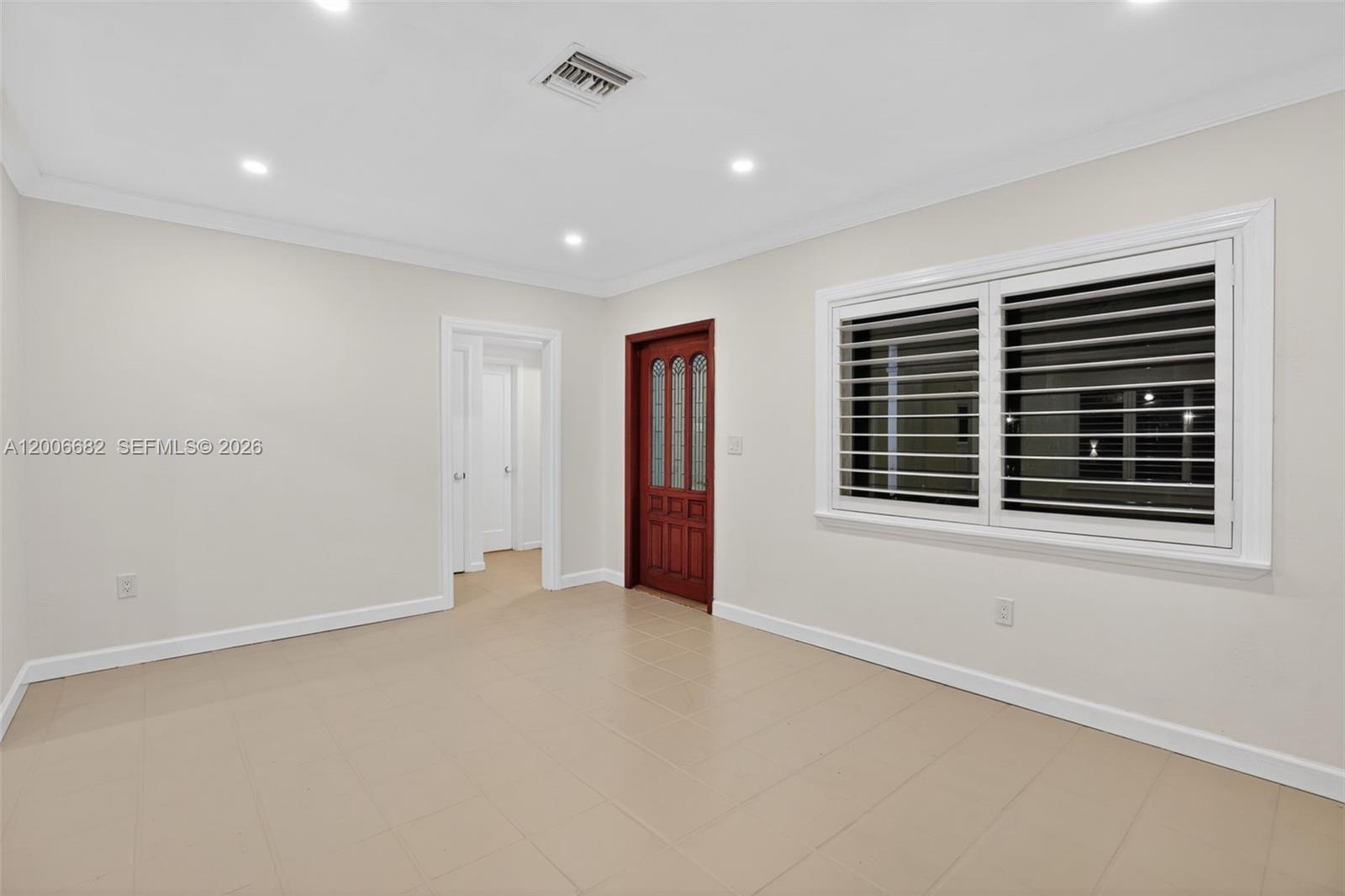 1435 Blue Road Coral Gables, FL 33146 - Photo 6 of 31 a view of an empty room with a window