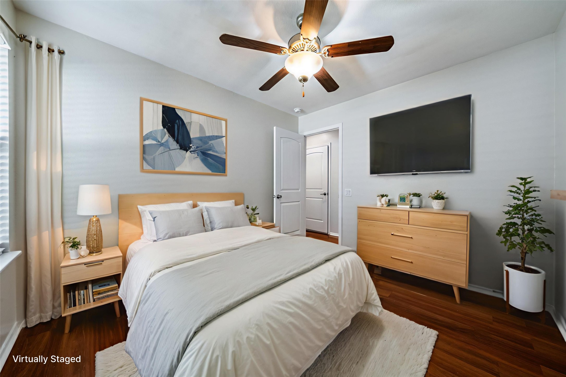 7124 Outfitter Drive Austin, TX 78744 - Photo 13 of 25 a spacious bedroom with a bed and a flat screen tv
