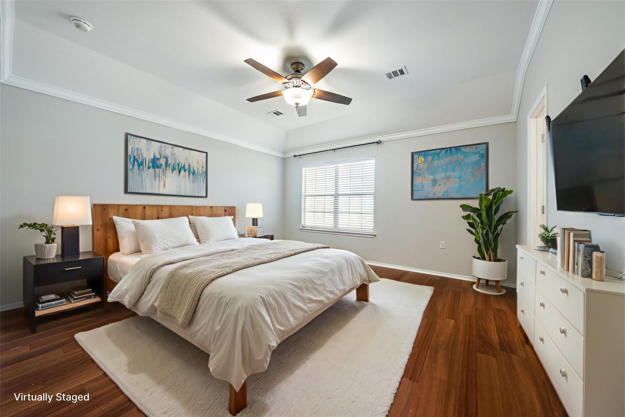 7124 Outfitter Drive Austin, TX 78744 - Photo 17 of 25 a spacious bedroom with a large bed and a flat screen tv