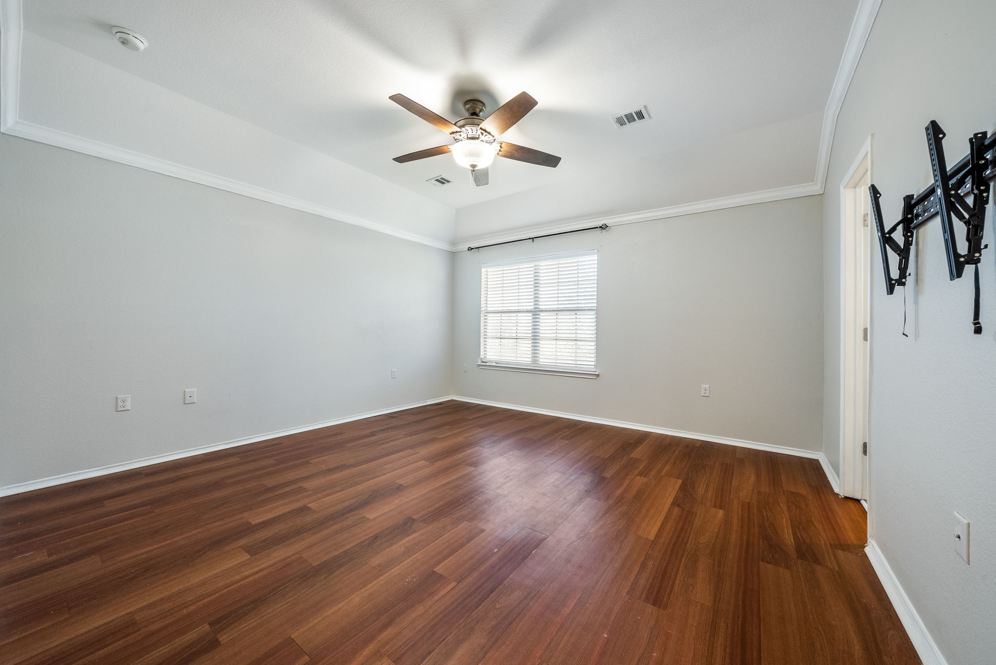 7124 Outfitter Drive Austin, TX 78744 - Photo 18 of 25 wooden floor in an empty room with a window
