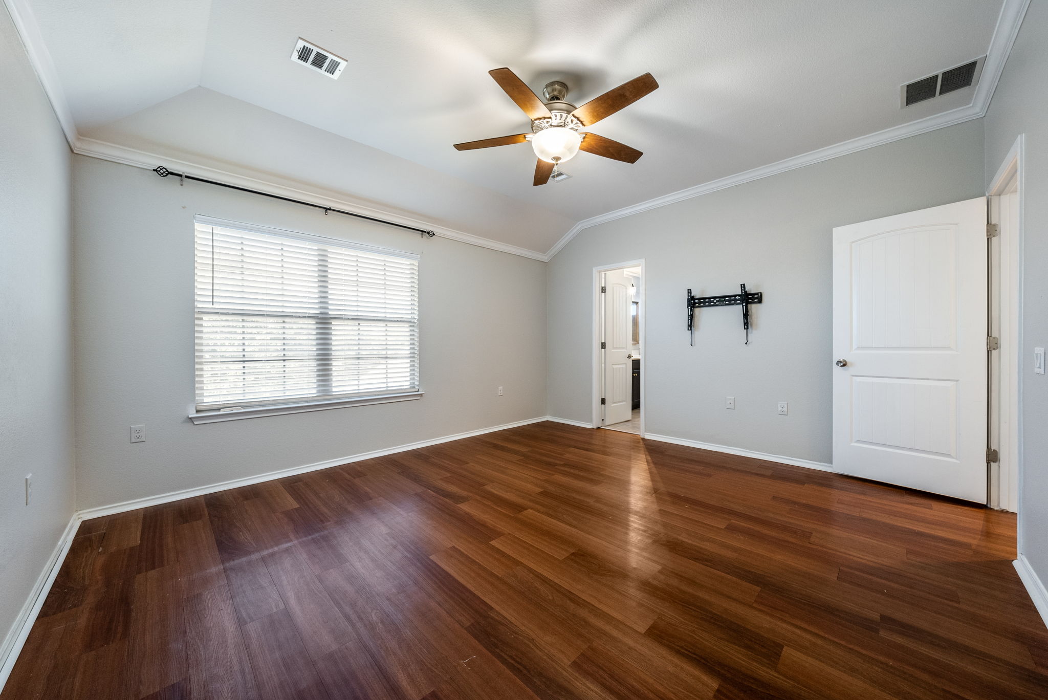 7124 Outfitter Drive Austin, TX 78744 - Photo 19 of 25 wooden floor in an empty room with a window
