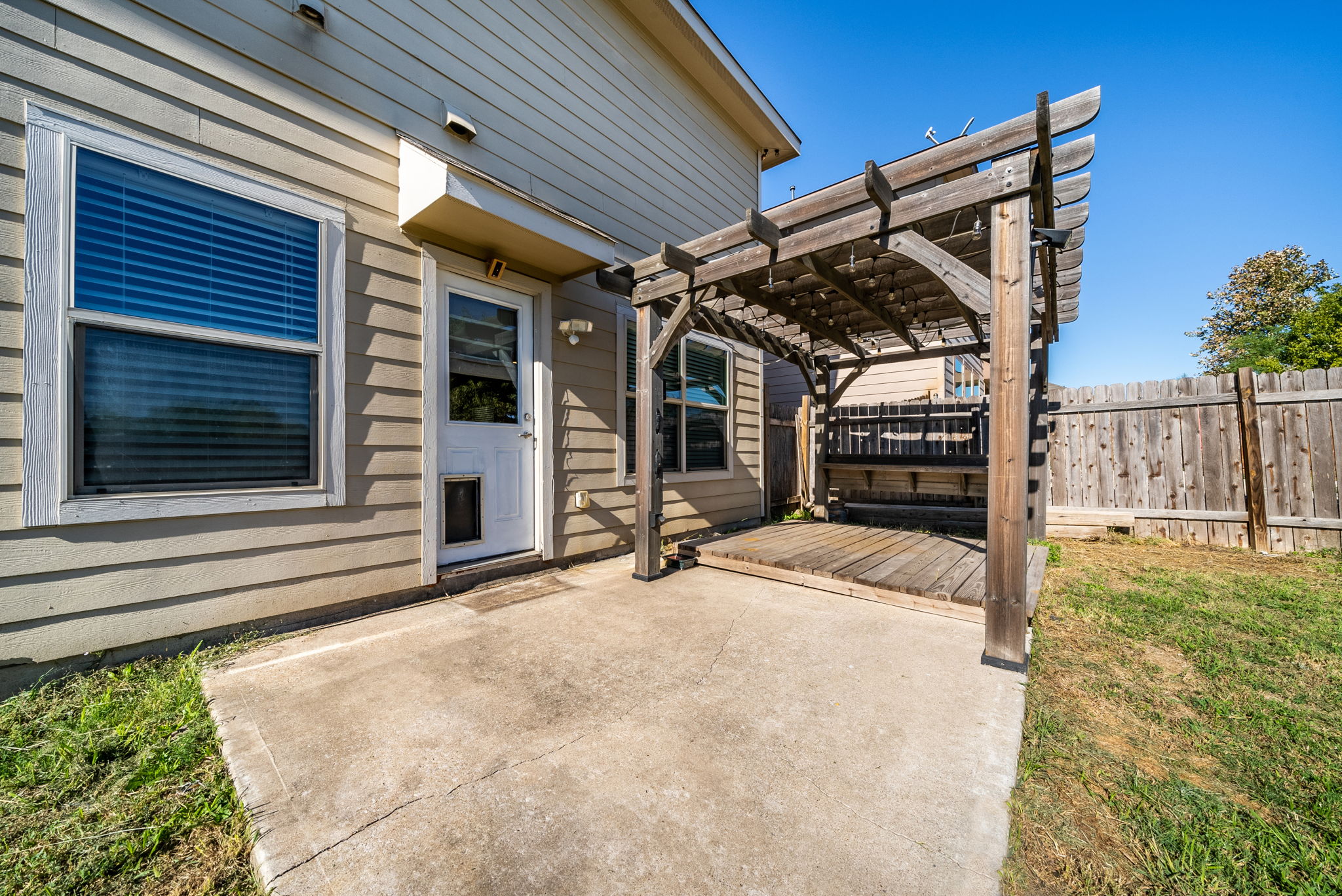 7124 Outfitter Drive Austin, TX 78744 - Photo 23 of 25 a view of house with backyard and porch