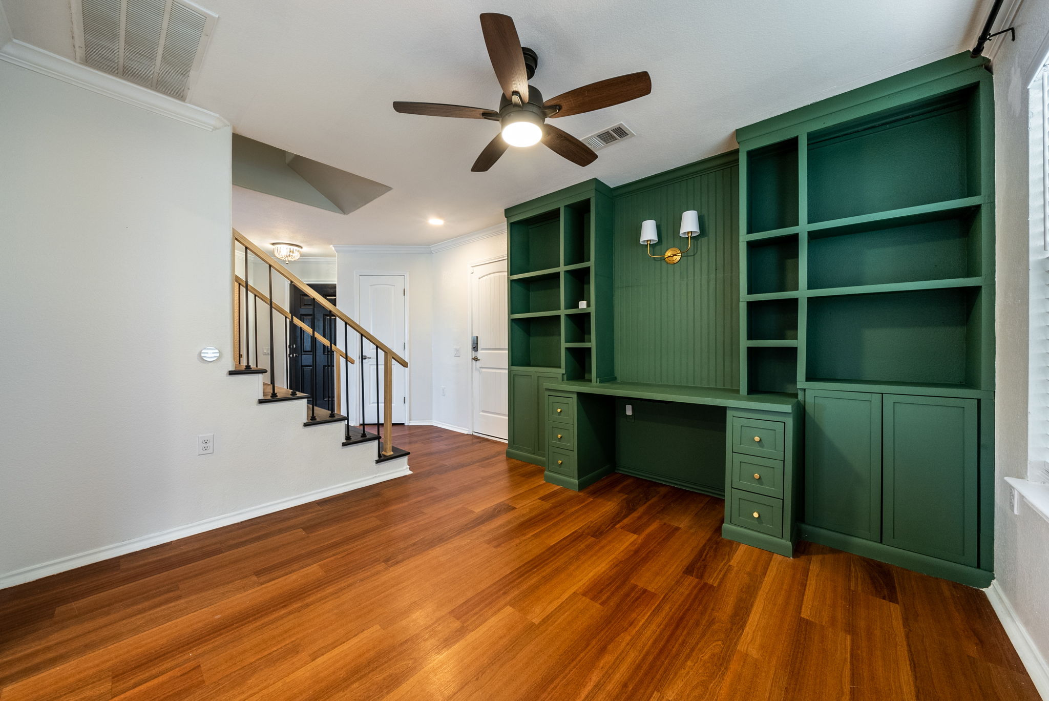 7124 Outfitter Drive Austin, TX 78744 - Photo 6 of 25 a room with hard wood floors and a ceiling fan
