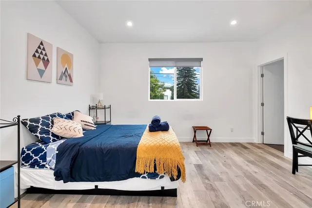 a bedroom with a bed and furniture