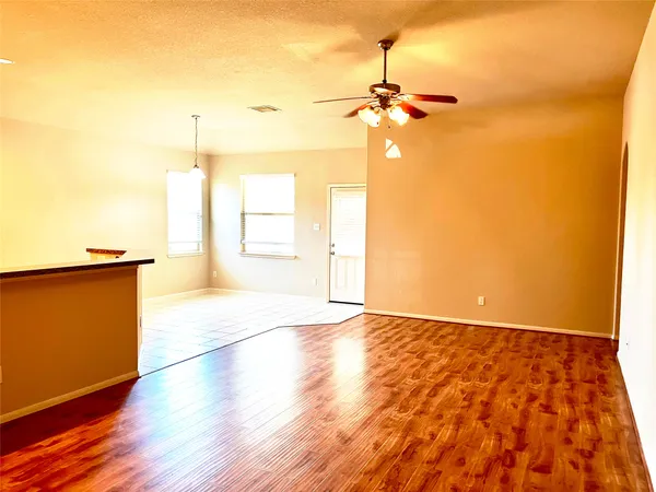 a view of an empty room and a window