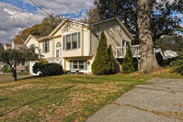 a front view of a house with a yard