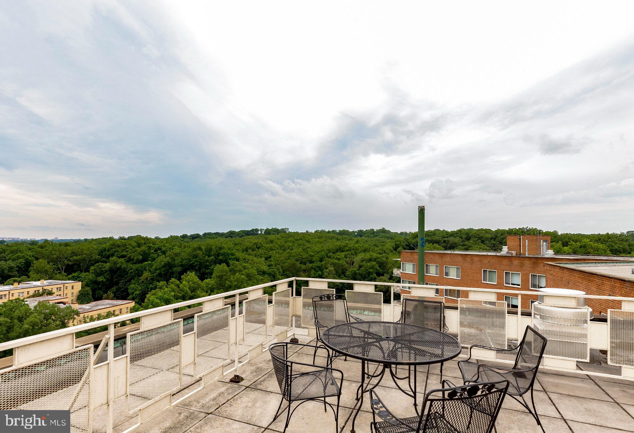 4000 Tunlaw Road Northwest, Unit 1030 Washington, DC 20007 - Photo 15 of 19 a view of a terrace with sitting space
