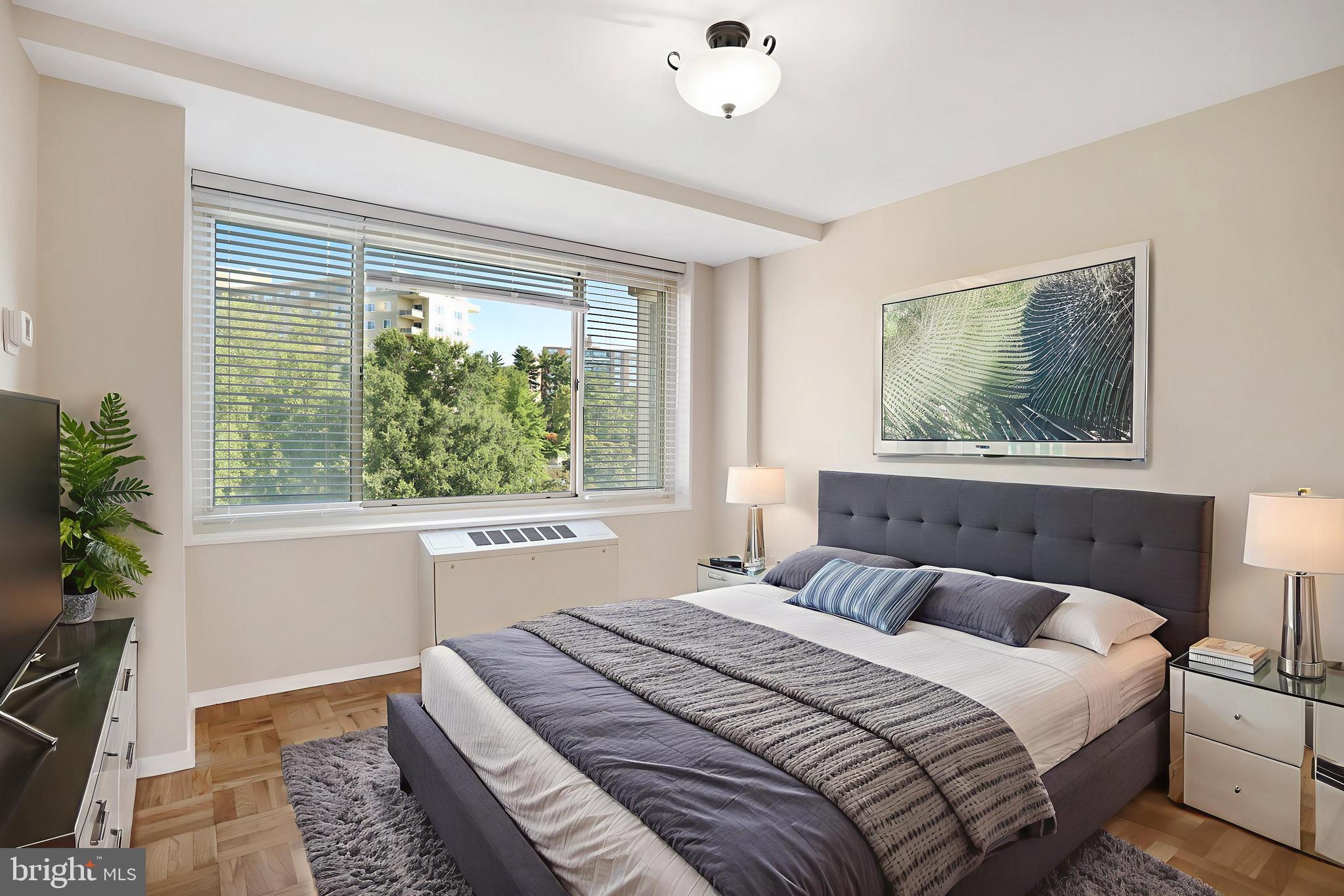 4000 Tunlaw Road Northwest, Unit 1030 Washington, DC 20007 - Photo 6 of 19 a bedroom with a large bed and a window