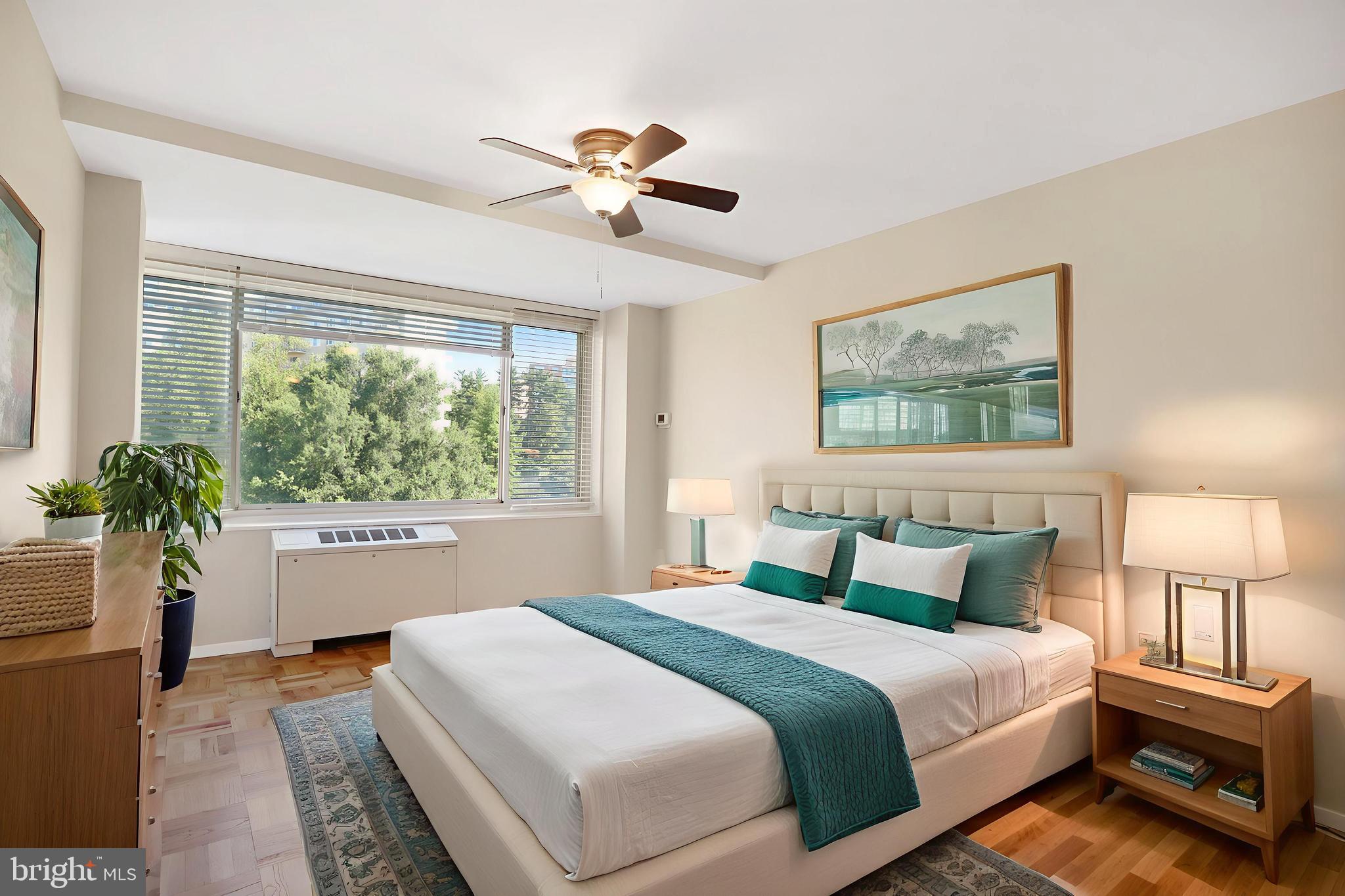 4000 Tunlaw Road Northwest, Unit 1030 Washington, DC 20007 - Photo 8 of 19 a bedroom with a large bed and a chandelier