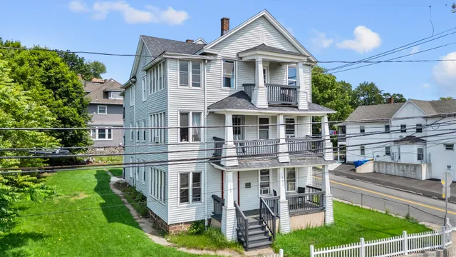front view of a house with a yard