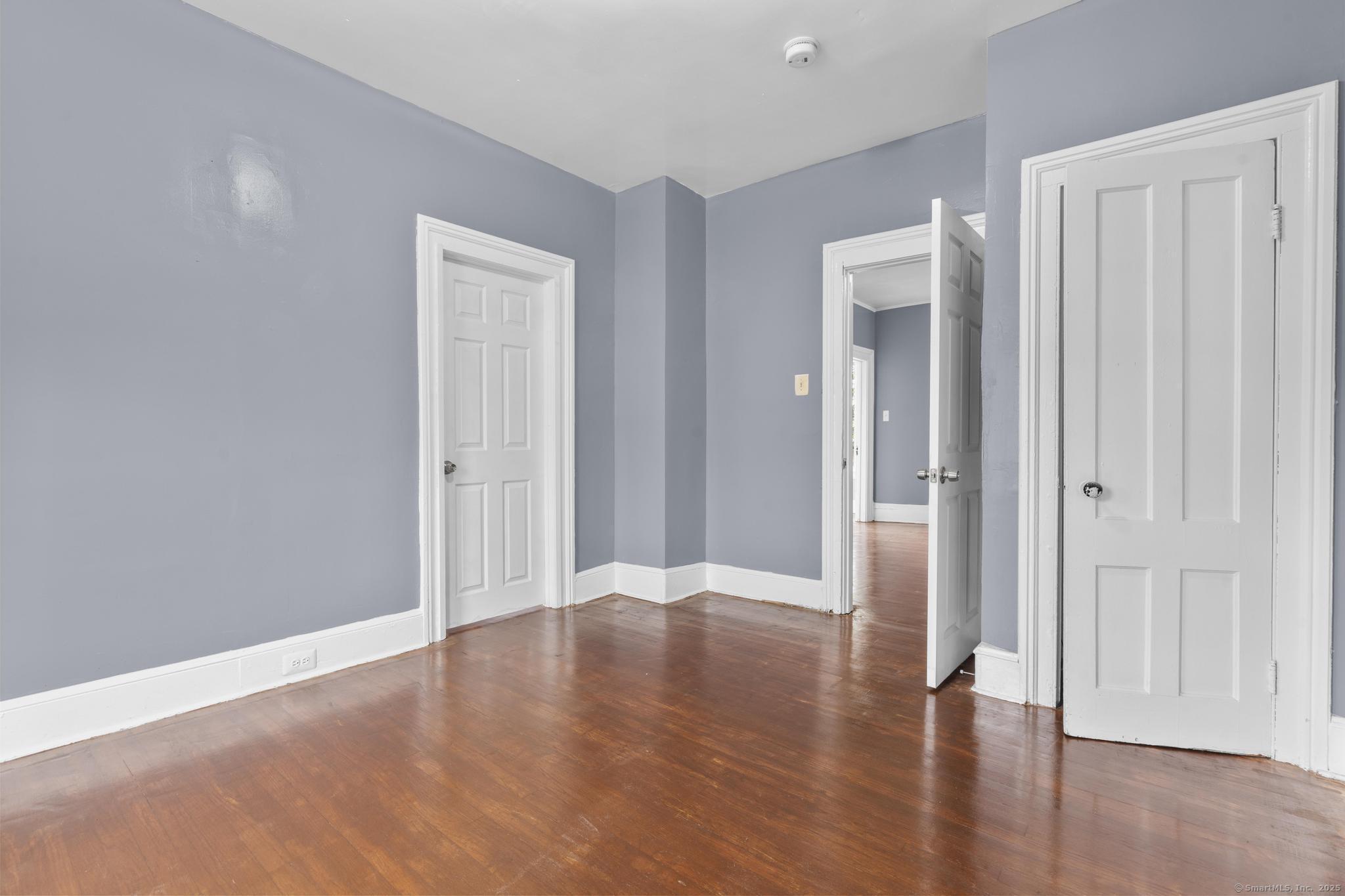 1105 North Main Street, Unit 1 Waterbury, CT 06704 - Photo 23 of 37 a view of an empty room with wooden floor