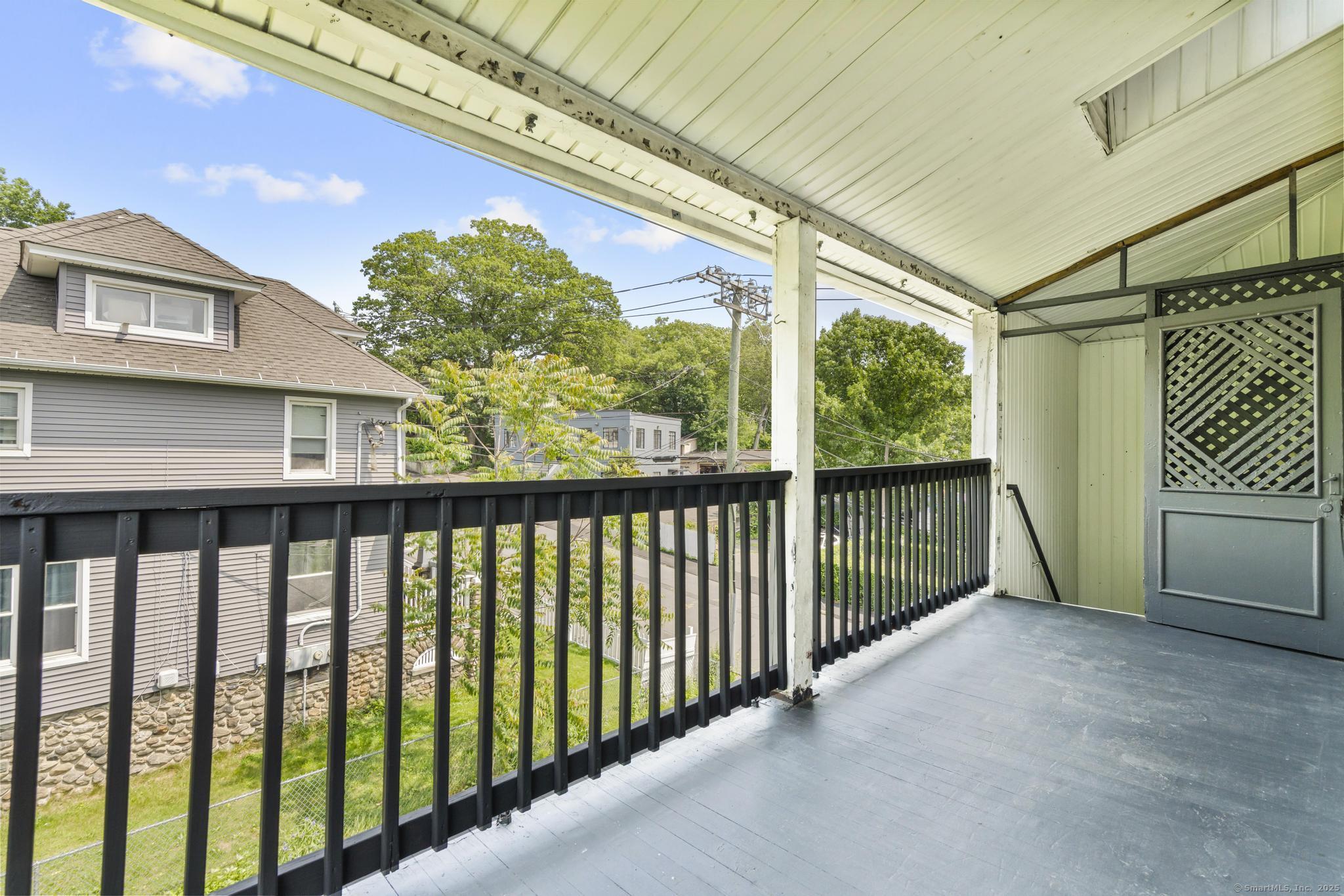 1105 North Main Street, Unit 1 Waterbury, CT 06704 - Photo 8 of 37 a view of a balcony