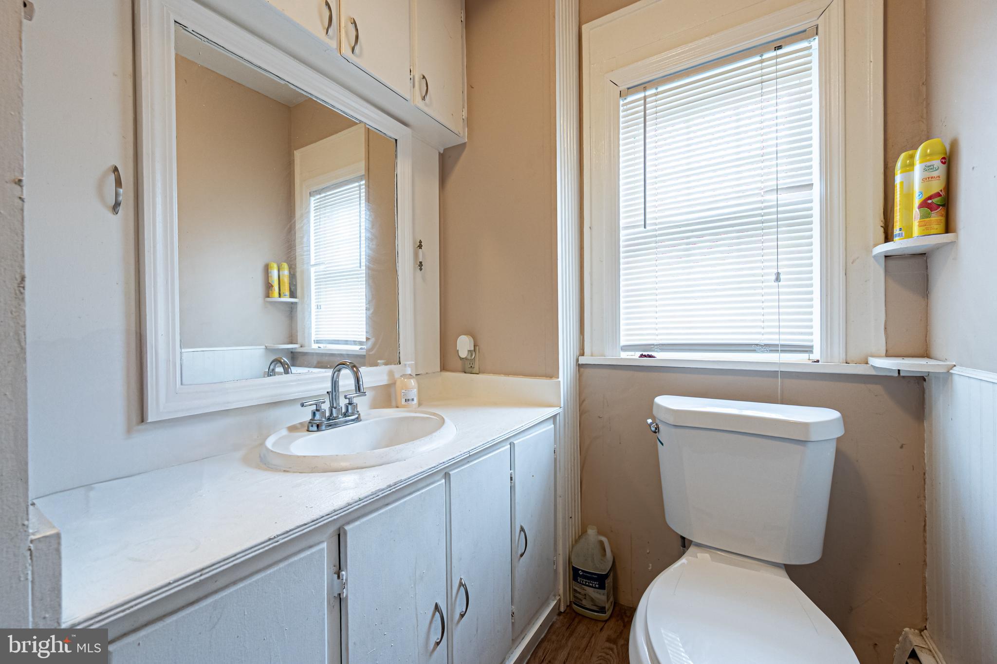 706 Augustine Road Atlantic City, NJ 08401 - Photo 17 of 29 a bathroom with a toilet a sink and a mirror