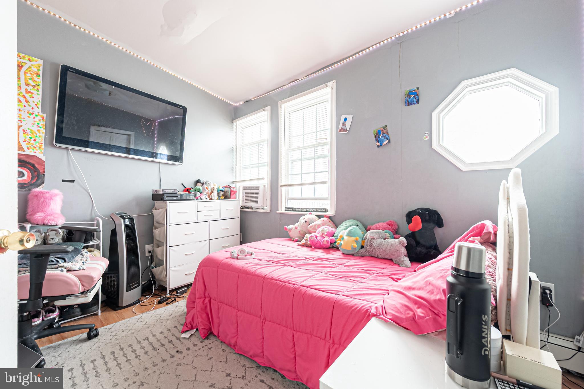 706 Augustine Road Atlantic City, NJ 08401 - Photo 20 of 29 a bedroom with a bed a dresser and flat screen tv