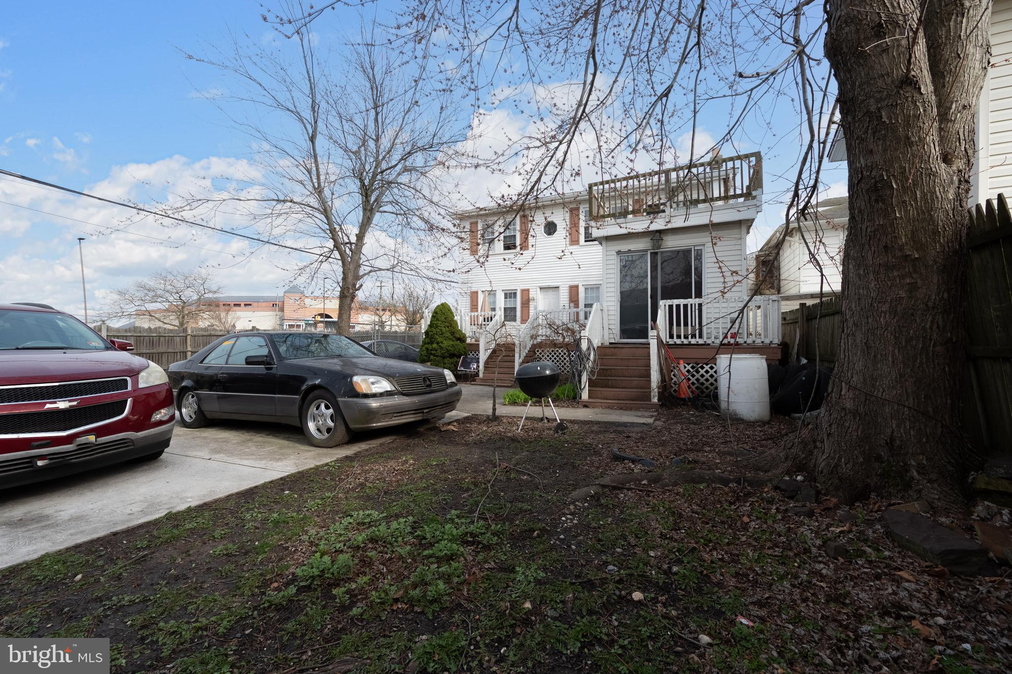 706 Augustine Road Atlantic City, NJ 08401 - Photo 2 of 29 a view of a cars park in front of house