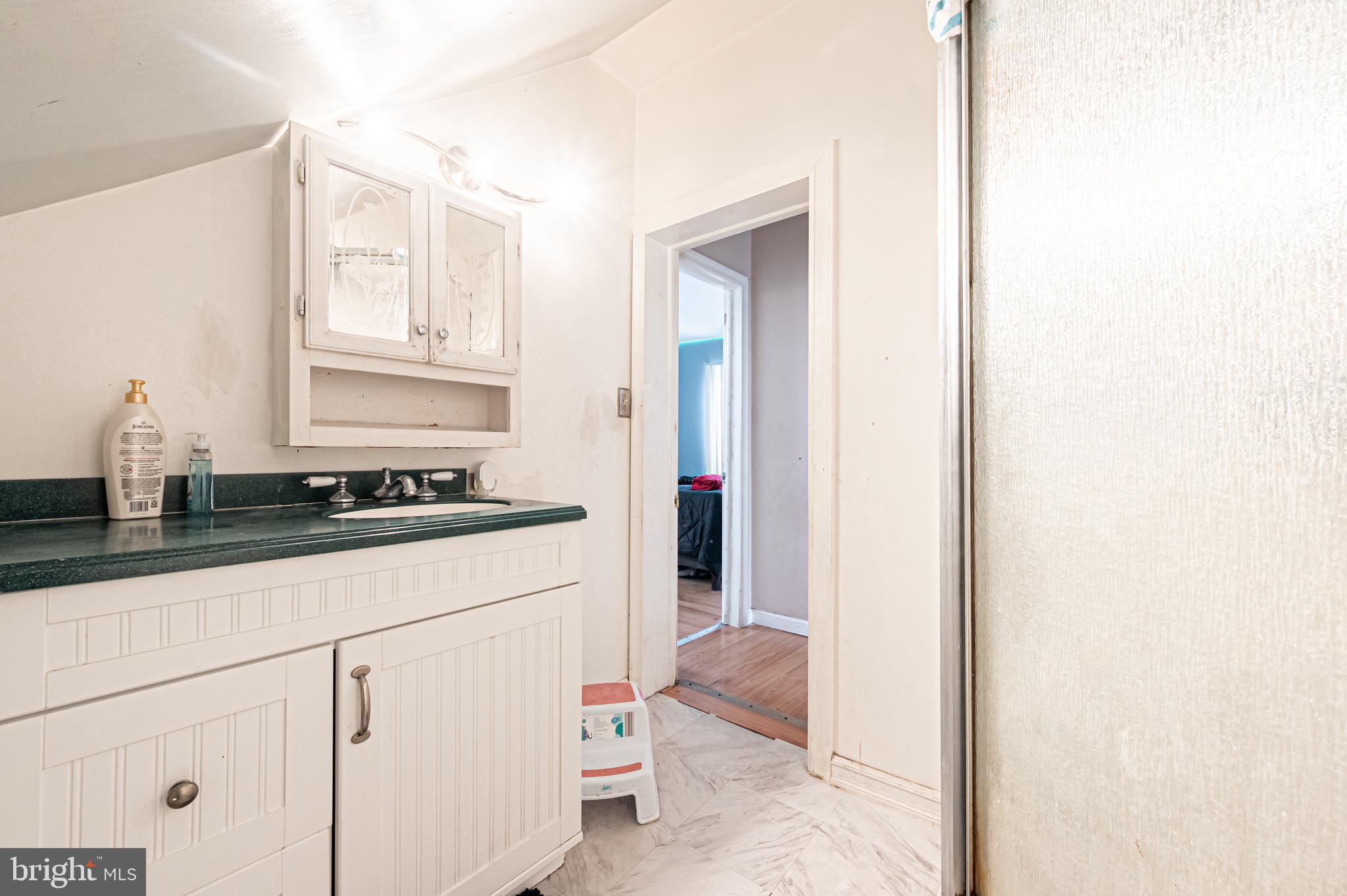 706 Augustine Road Atlantic City, NJ 08401 - Photo 23 of 29 a kitchen with granite countertop a sink and cabinets