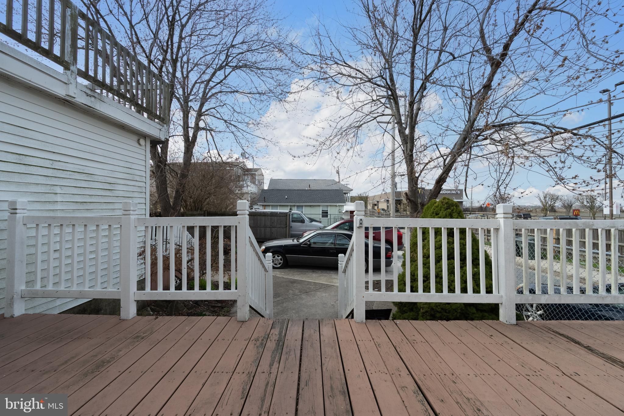 706 Augustine Road Atlantic City, NJ 08401 - Photo 28 of 29 a view of a deck with wooden floor and fence