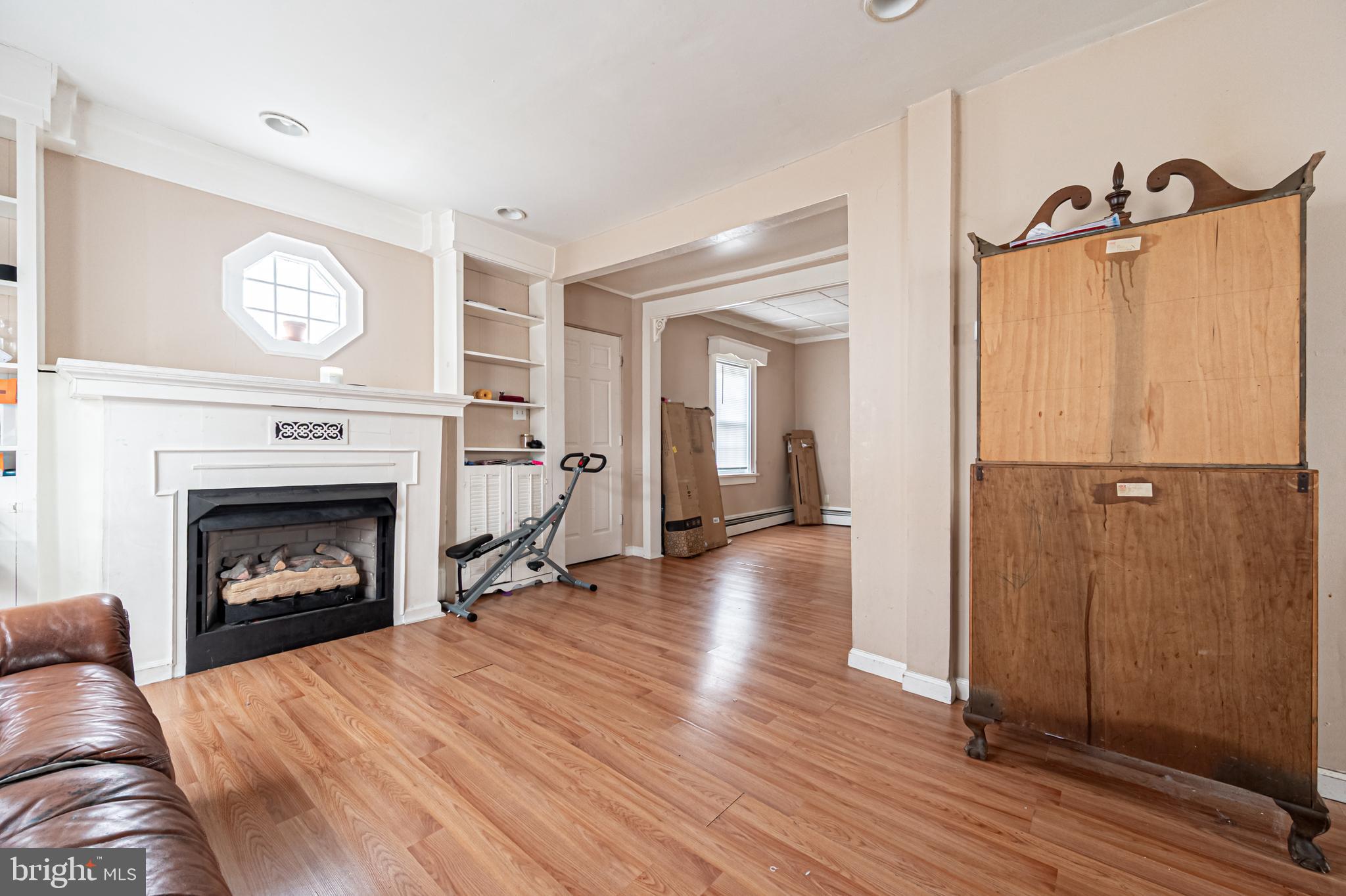 706 Augustine Road Atlantic City, NJ 08401 - Photo 6 of 29 a living room with furniture and a fireplace