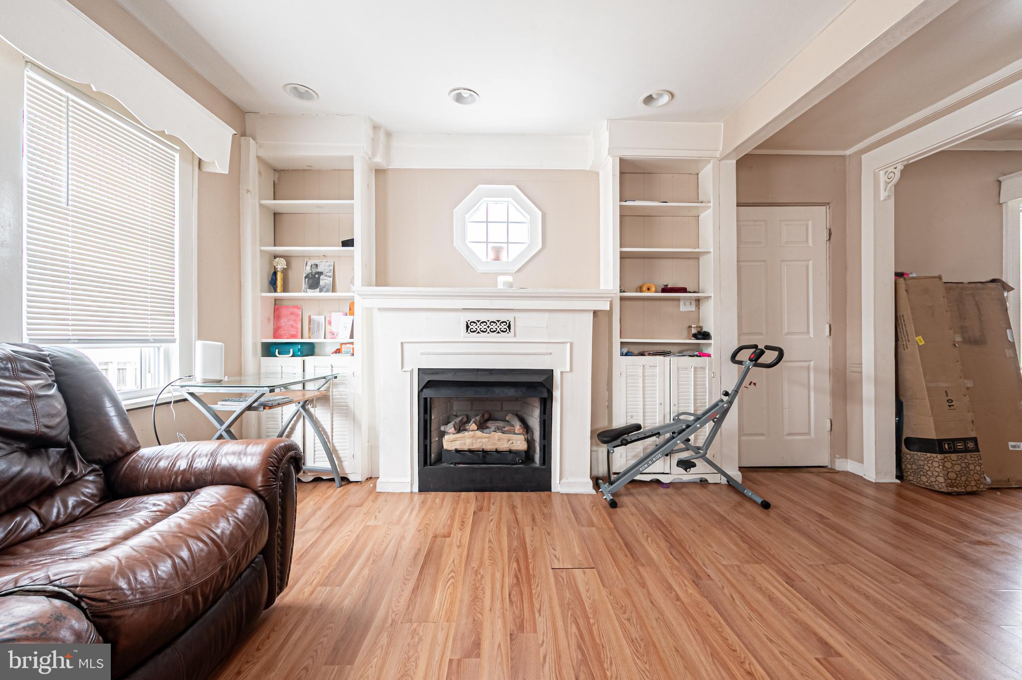 706 Augustine Road Atlantic City, NJ 08401 - Photo 8 of 29 a living room with furniture a fireplace and a window
