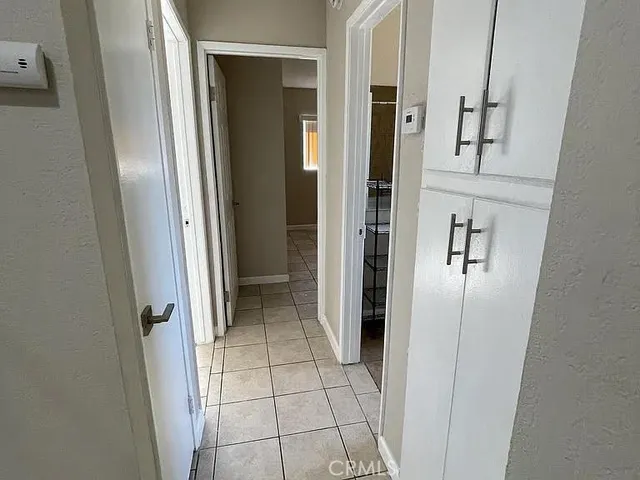 a bathroom with a sink a mirror and a glass door shower