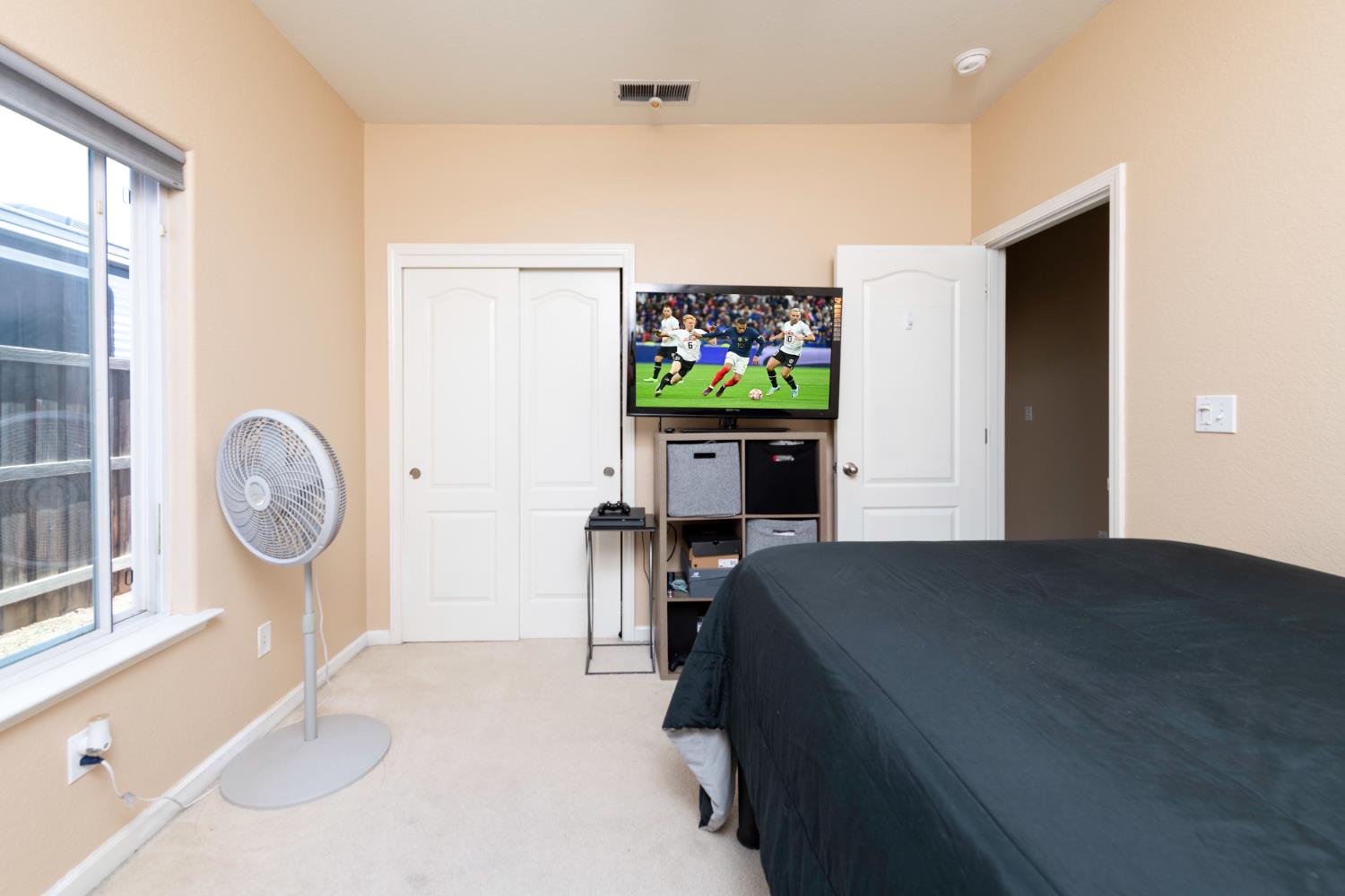 6525 East Raco Avenue Fresno, CA 93727 - Photo 15 of 27 a living room with furniture and a flat screen tv