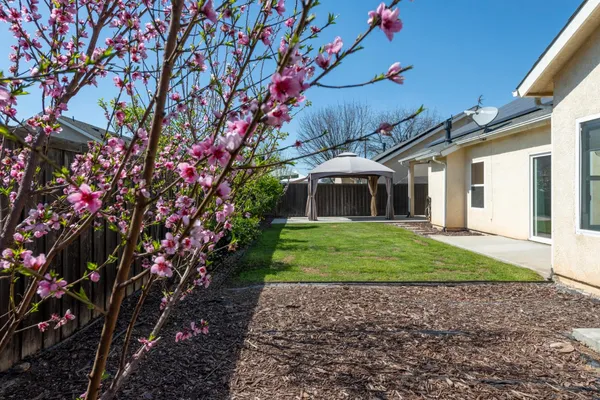 a couple of table and chairs under an umbrella