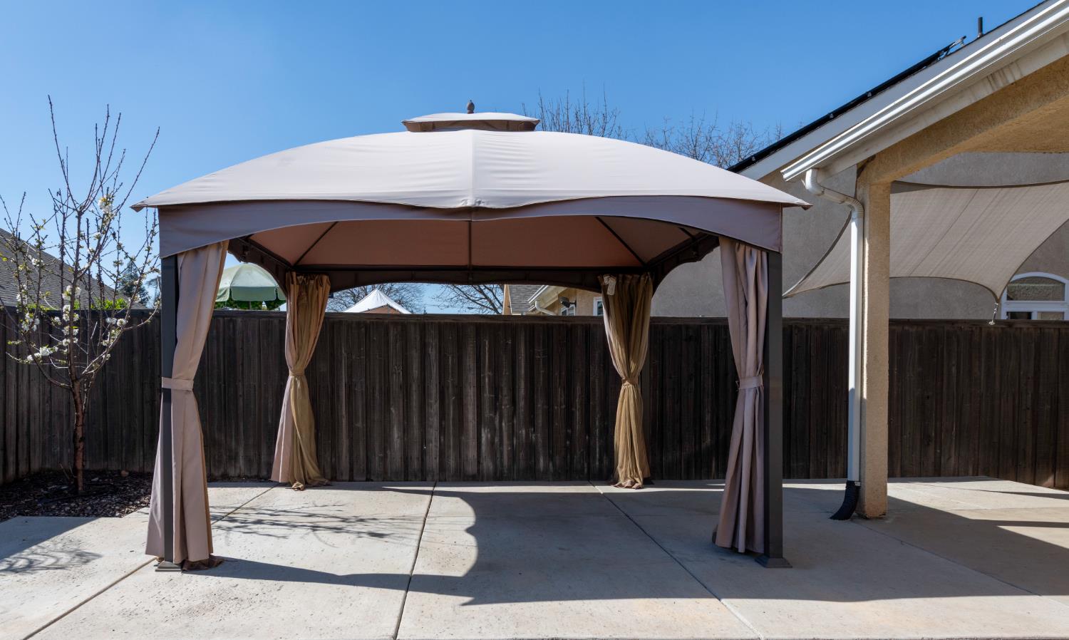6525 East Raco Avenue Fresno, CA 93727 - Photo 24 of 27 a couple of table and chairs under an umbrella
