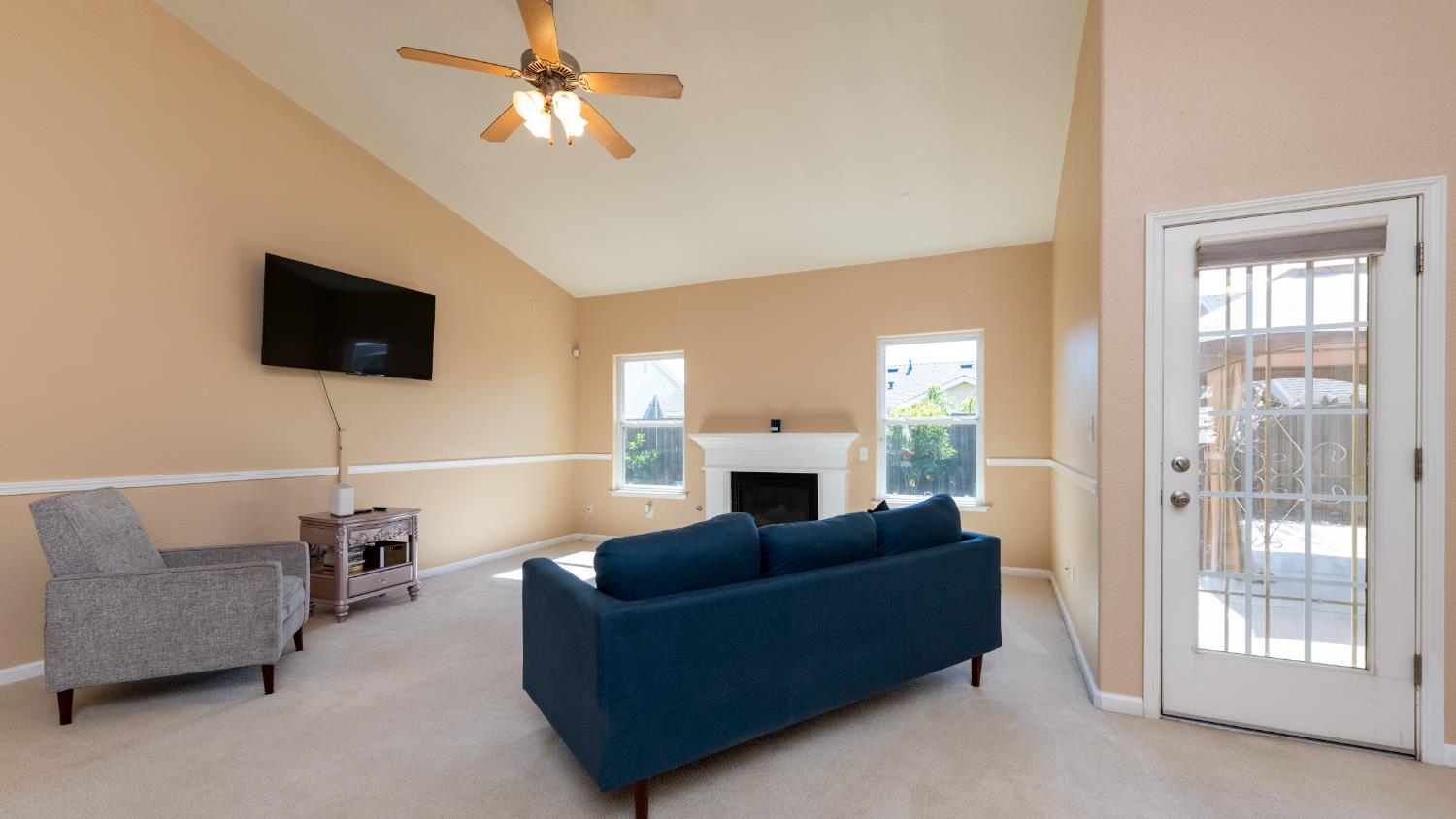 6525 East Raco Avenue Fresno, CA 93727 - Photo 4 of 27 a living room with furniture and a flat screen tv