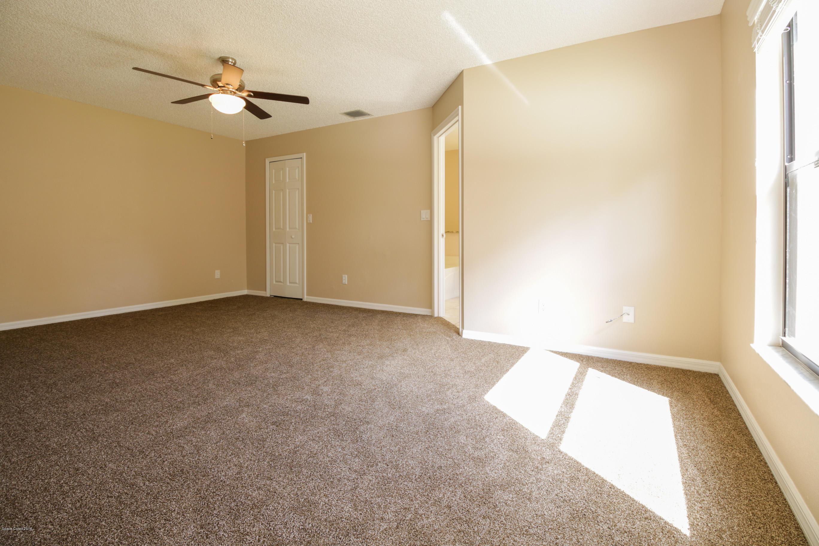 441 Wildmer Road Southwest Palm Bay, FL 32908 - Photo 29 of 67 a view of an empty room and a window