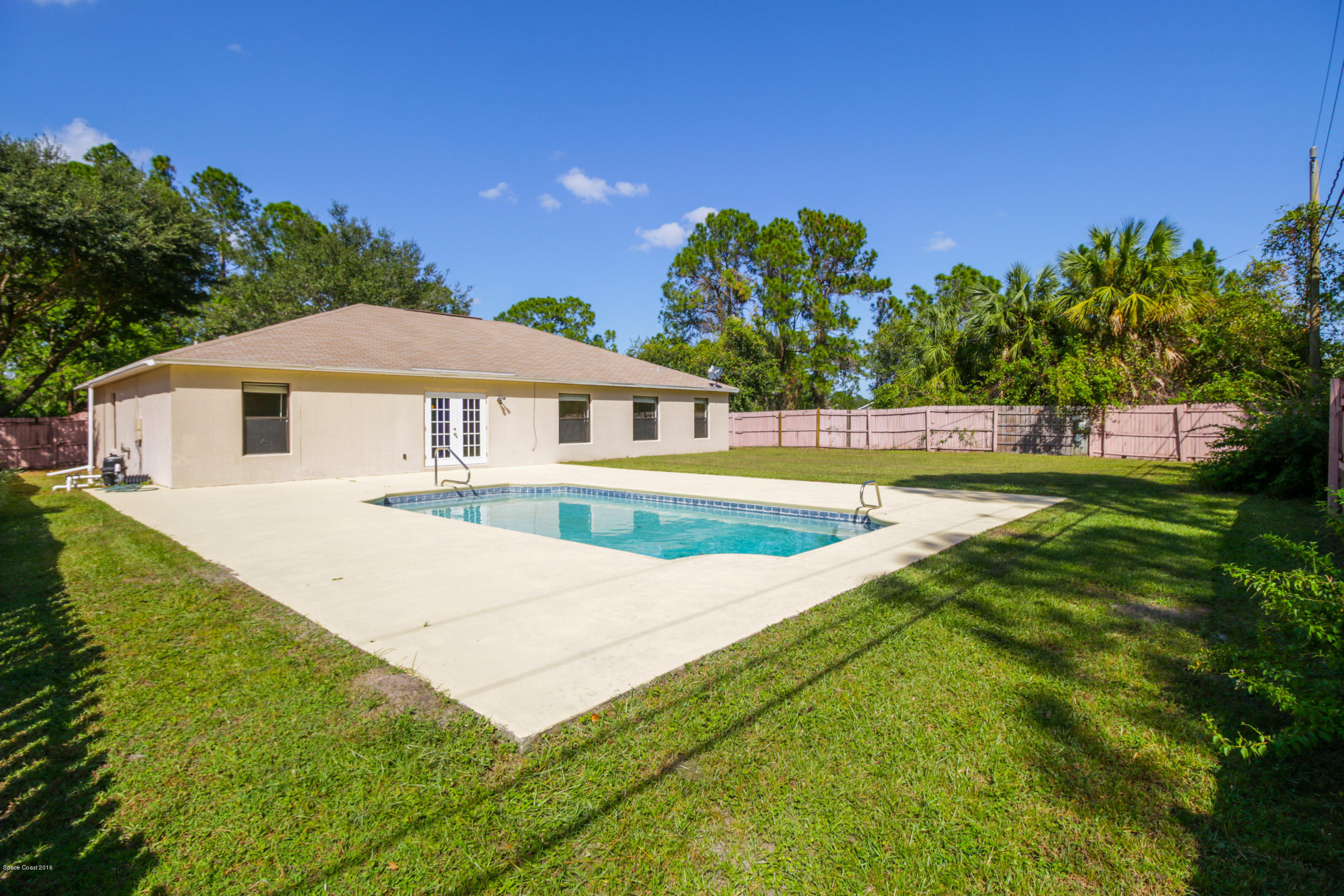441 Wildmer Road Southwest Palm Bay, FL 32908 - Photo 4 of 67 a view of a house with a big yard