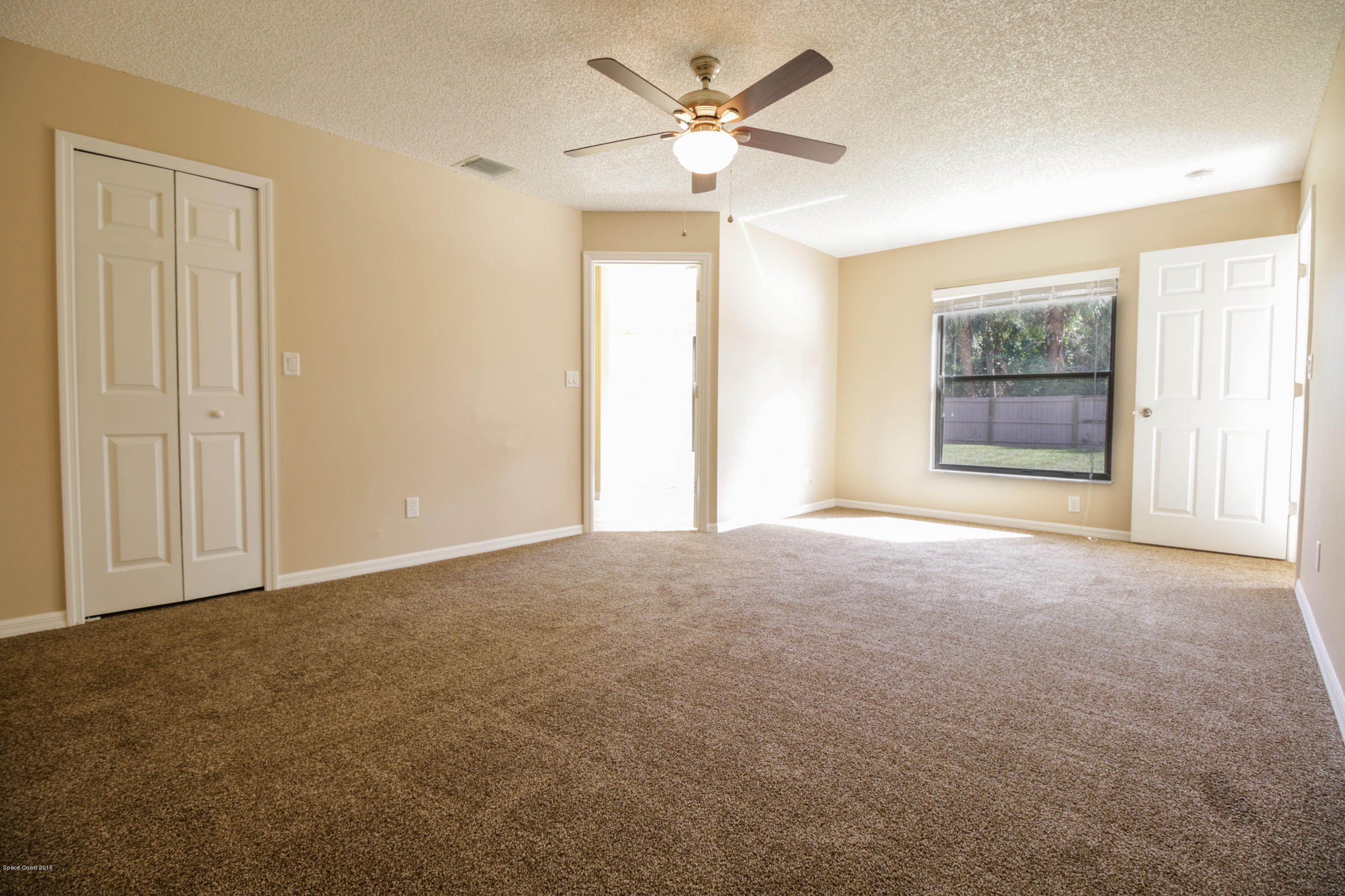 441 Wildmer Road Southwest Palm Bay, FL 32908 - Photo 33 of 67 a view of an empty room with a window