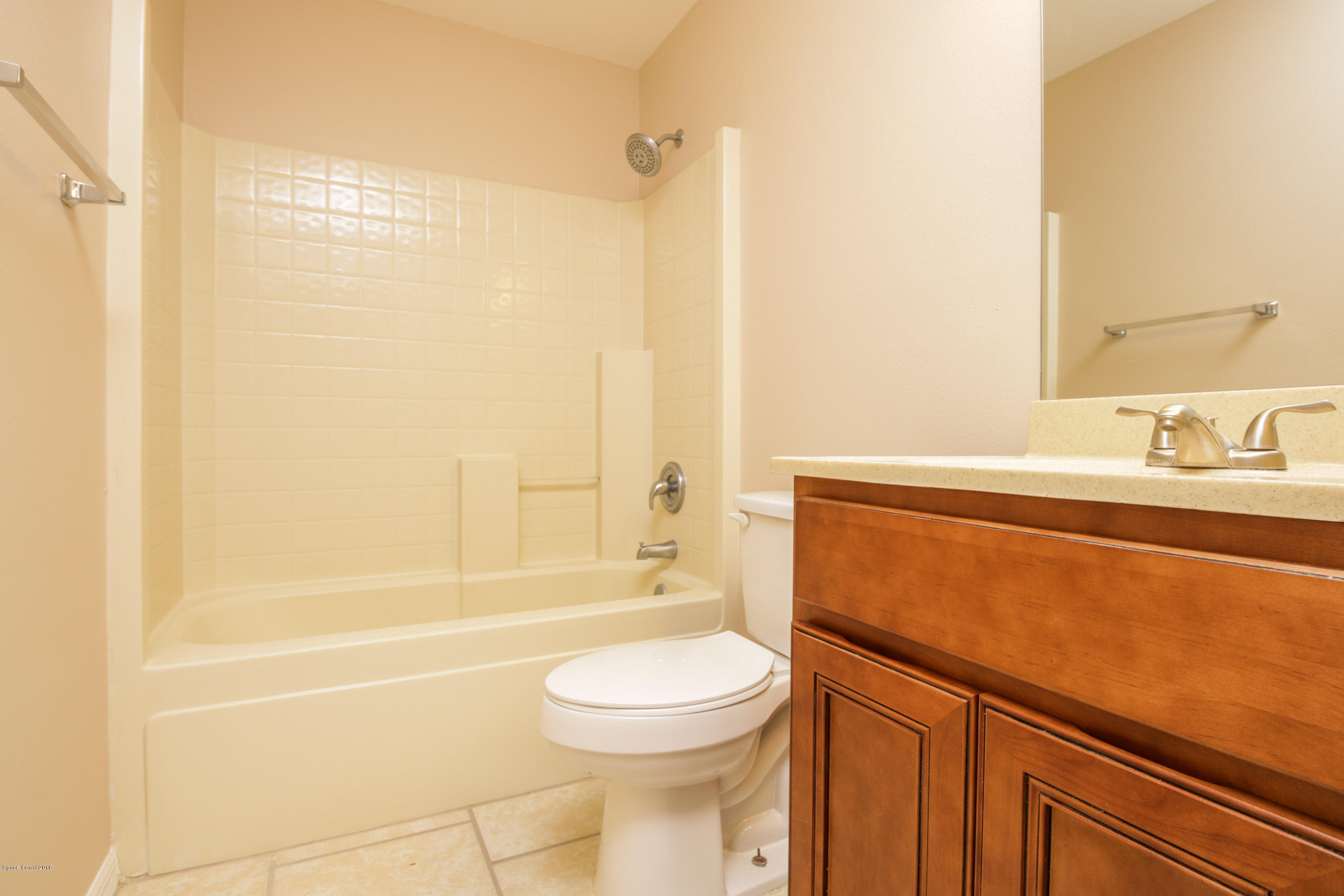 441 Wildmer Road Southwest Palm Bay, FL 32908 - Photo 49 of 67 a bathroom with a sink a toilet and shower