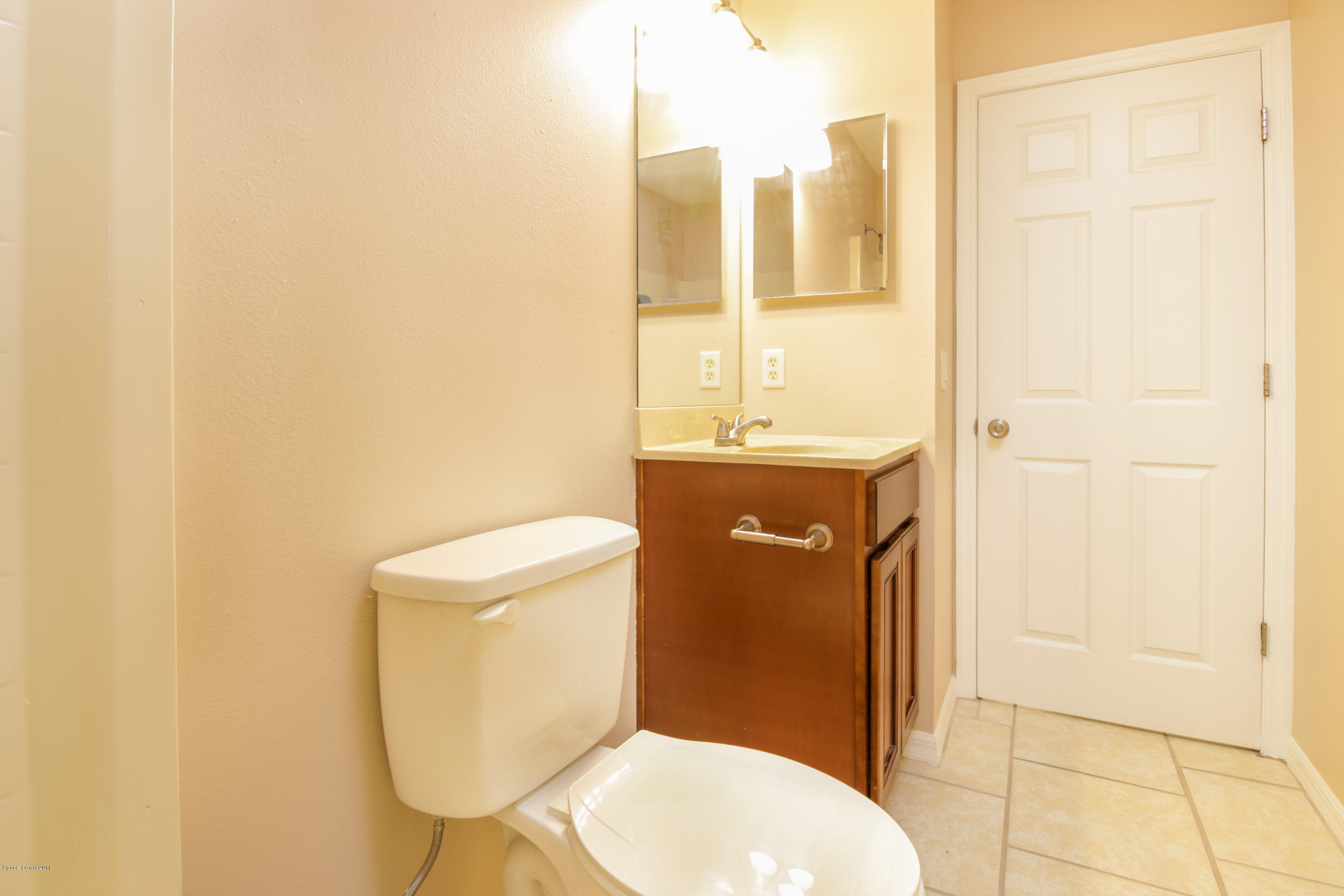 441 Wildmer Road Southwest Palm Bay, FL 32908 - Photo 52 of 67 a bathroom with a toilet and a sink