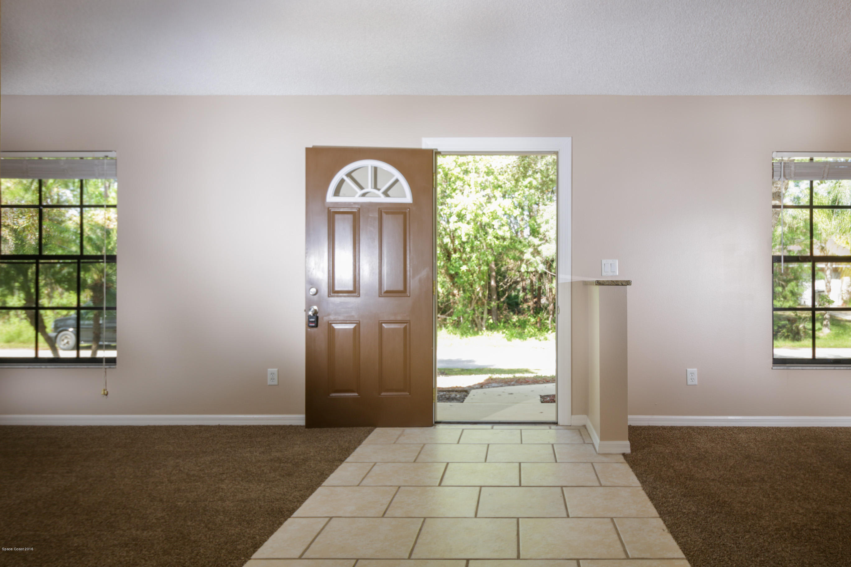 441 Wildmer Road Southwest Palm Bay, FL 32908 - Photo 58 of 67 a view of an empty room with a window