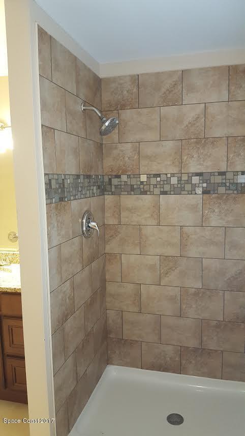 441 Wildmer Road Southwest Palm Bay, FL 32908 - Photo 63 of 67 a bathroom with a shower