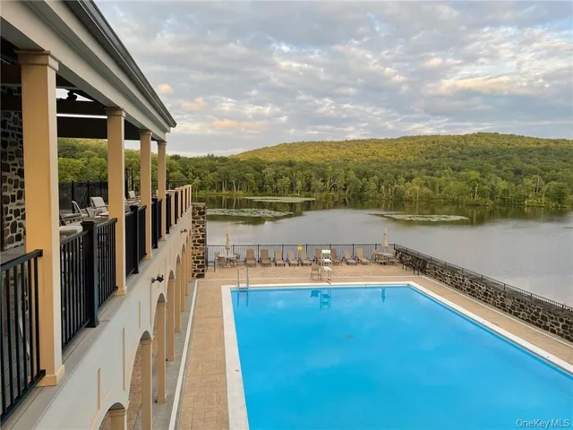 a view of a swimming pool with an ocean view