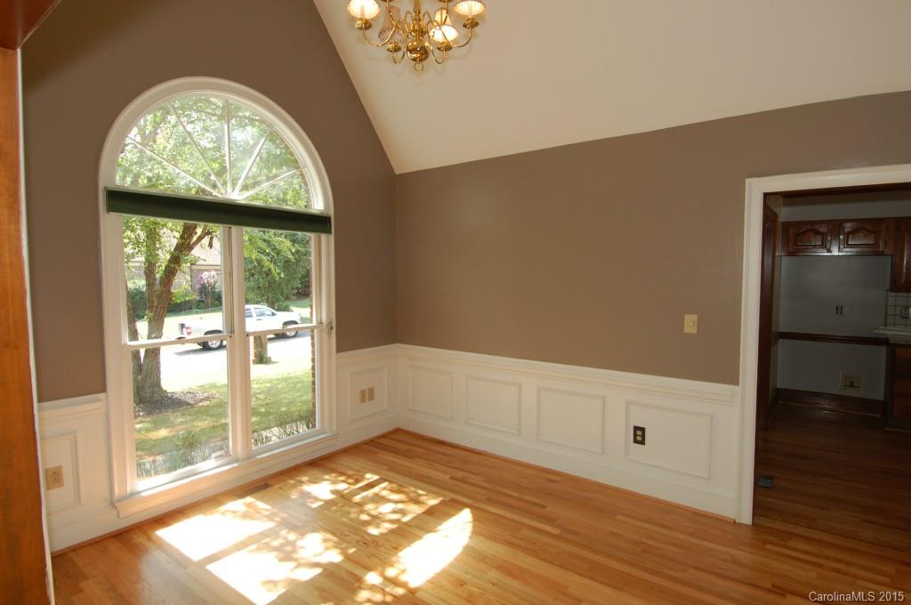 425 St Michaels Way Fort Mill, SC 29708 - Photo 2 of 21 wooden floor in an empty room with a window