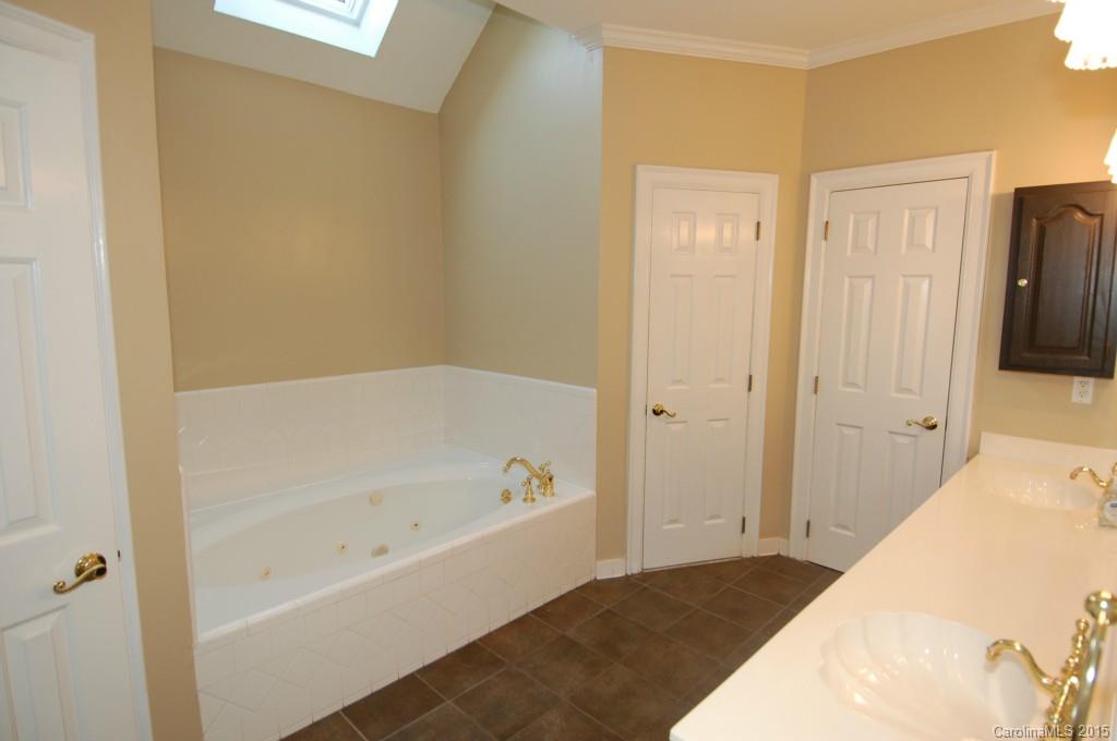 425 St Michaels Way Fort Mill, SC 29708 - Photo 13 of 21 a bathroom with a bathtub and shower