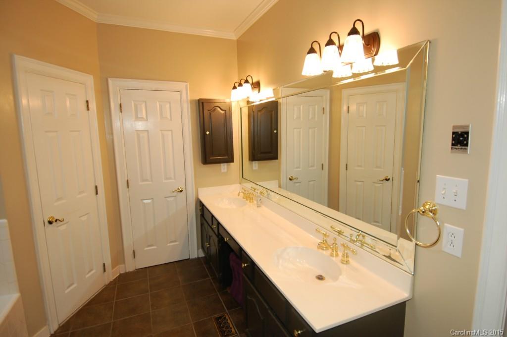 425 St Michaels Way Fort Mill, SC 29708 - Photo 14 of 21 a bathroom with a double vanity sink mirror and shower