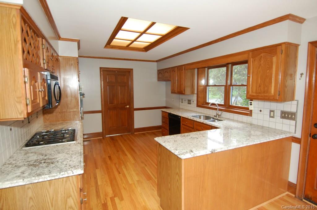 425 St Michaels Way Fort Mill, SC 29708 - Photo 3 of 21 a kitchen with stainless steel appliances granite countertop a sink and a stove