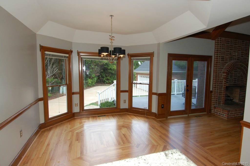 425 St Michaels Way Fort Mill, SC 29708 - Photo 6 of 21 a view of a livingroom with wooden floor and a large window