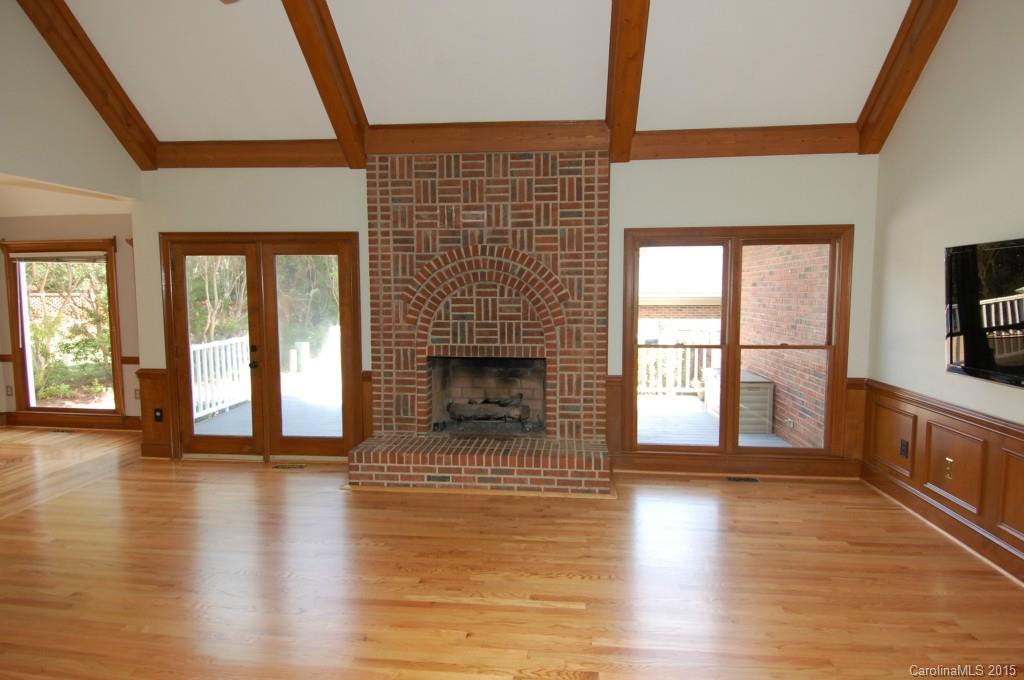 425 St Michaels Way Fort Mill, SC 29708 - Photo 10 of 21 a view of an empty room with wooden floor and a window