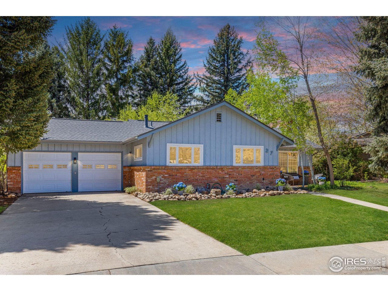 27 Cornell Drive Longmont, CO 80503 - Photo 1 of 33 front view of a house with a yard