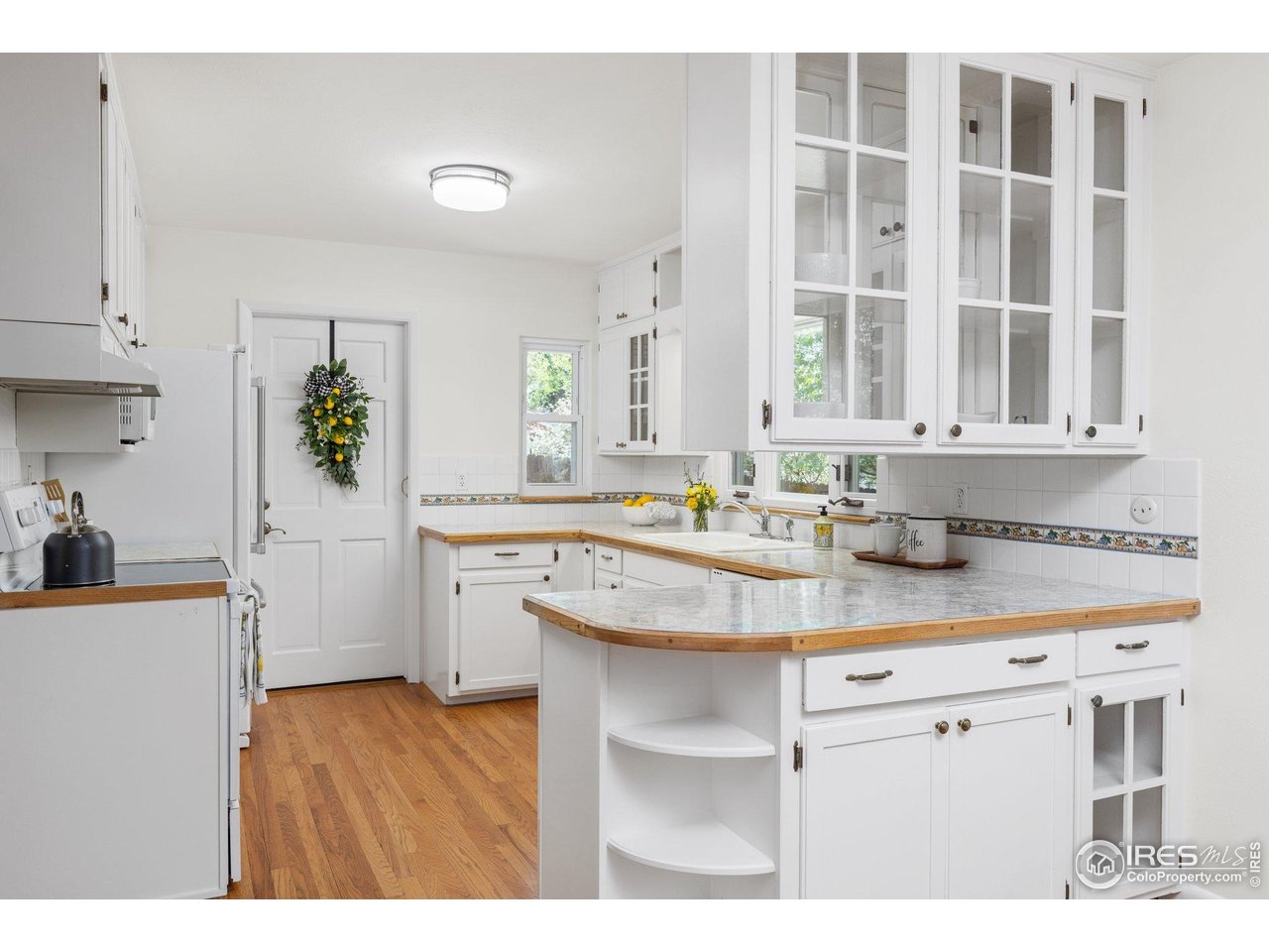 27 Cornell Drive Longmont, CO 80503 - Photo 12 of 33 a kitchen with a sink stove and cabinets